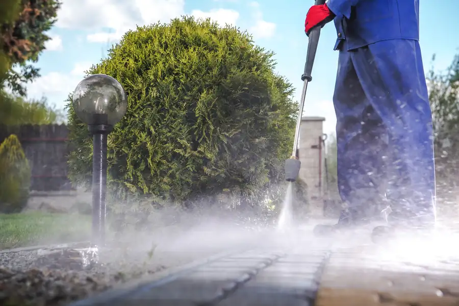 Jet washing a block paved driveway South West Bin Cleaning Co