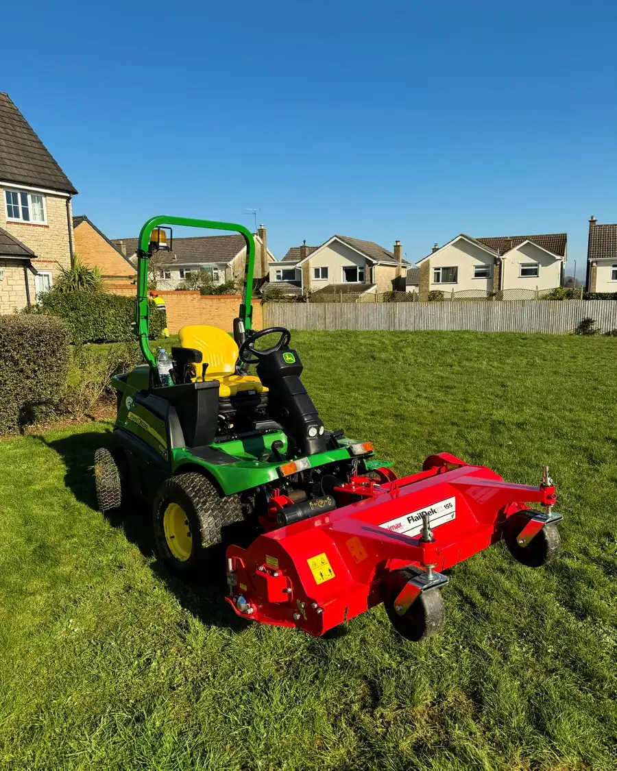 Ride-on mower on a freshly cut lawn South West Bin Cleaning Co grounds maintenance