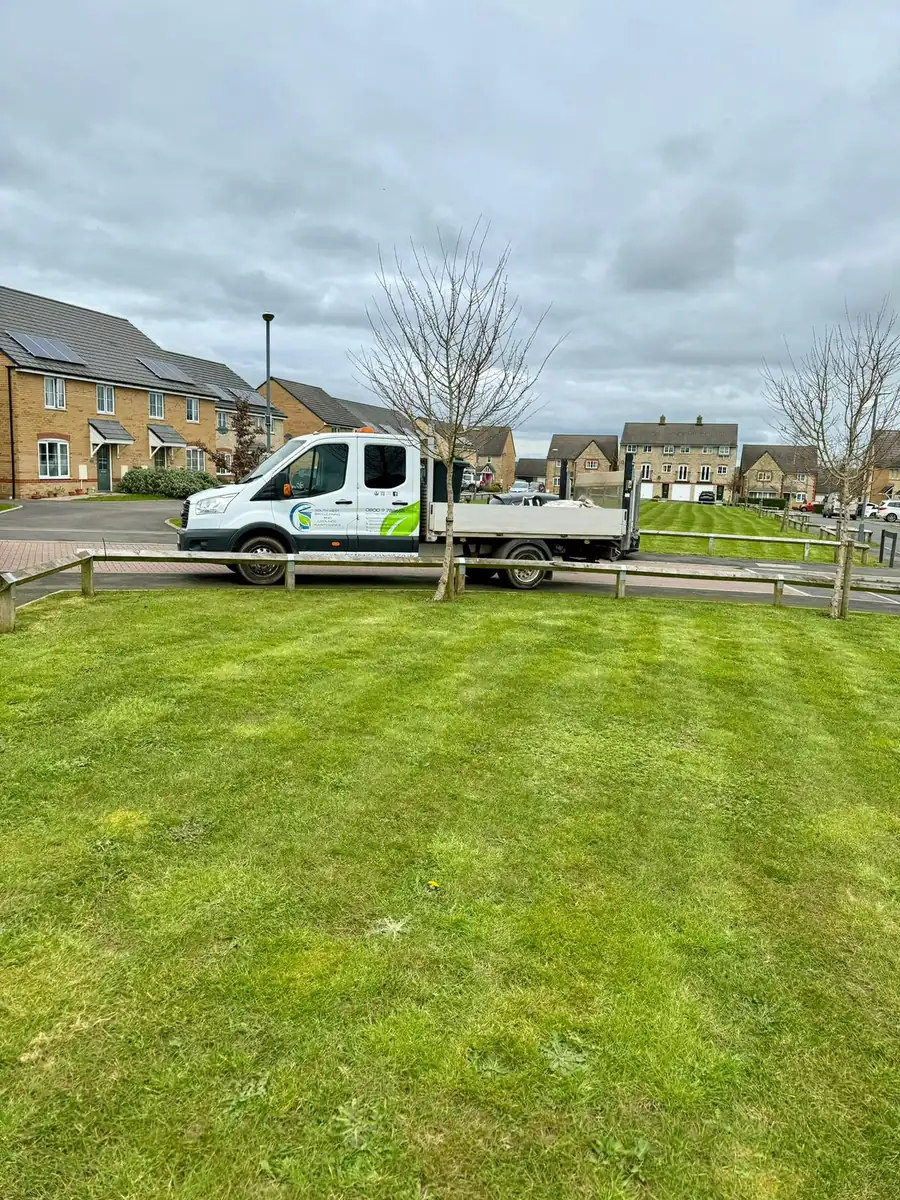 South West Bin Cleaning Co van beside a freshly mown green